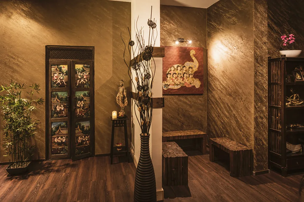 Entrance with a wooden floor, bamboo and warm wall lights